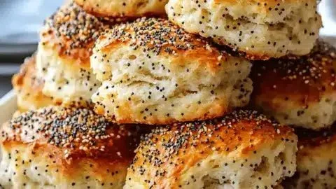 Freshly baked everything bagel biscuits with seasoning topping.