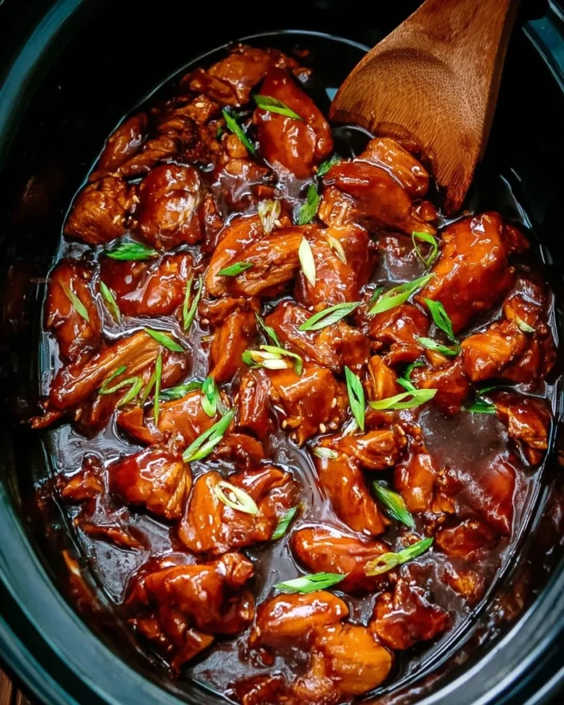 Delicious Bourbon Chicken prepared in a Crock Pot with flavorful sauce.