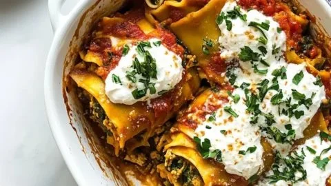 Delicious Chicken Lasagna Roll-Ups made with tender chicken and cheese
