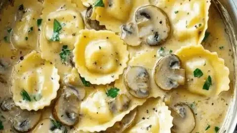 Creamy mushroom ravioli sauce served over fresh pasta