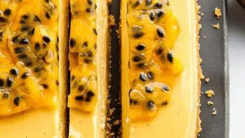 Delicious no bake passion fruit cheesecake topped with fresh fruit