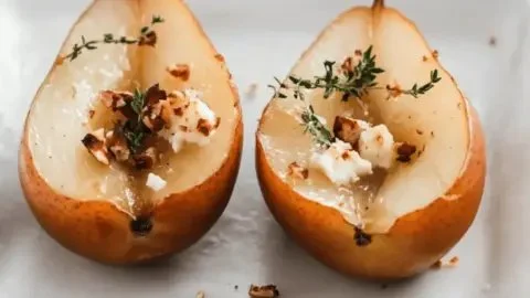 Delicious roasted pears topped with goat cheese, hazelnuts, and thyme