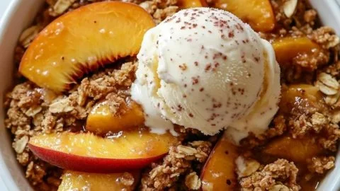 Delicious easy peach crisp baked with a golden topping.