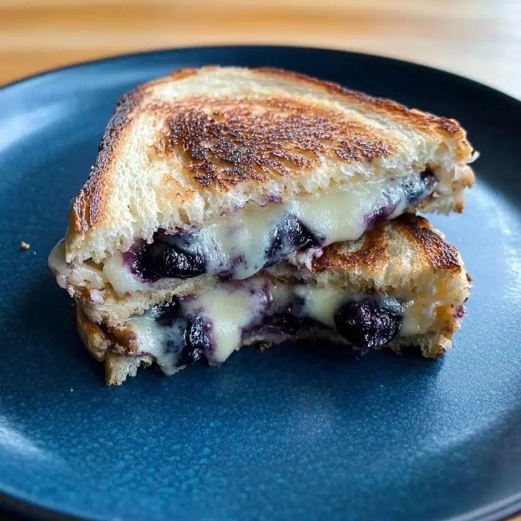 Blueberry grilled cheese sandwich with white cheddar on a plate