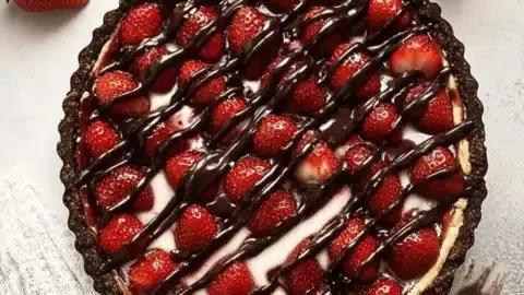 Delicious chocolate covered strawberry pie with fresh strawberries on top