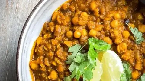 Lauki Chana Dal dish served in a bowl with garnishes.