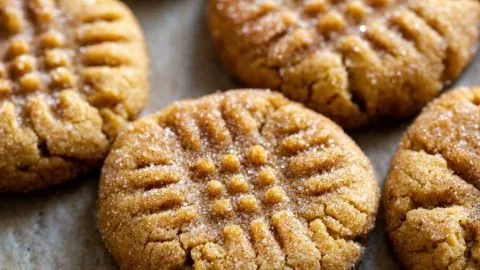 Lovely honey cookies arranged on a rustic wooden table.