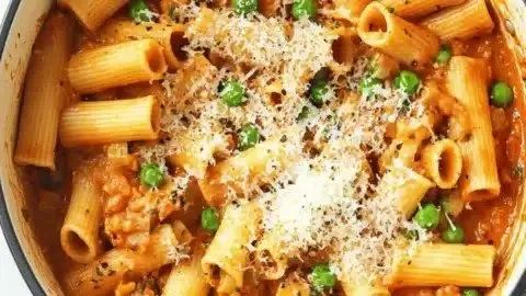 Delicious One Pot Spicy Rigatoni served in a bowl with fresh herbs on top