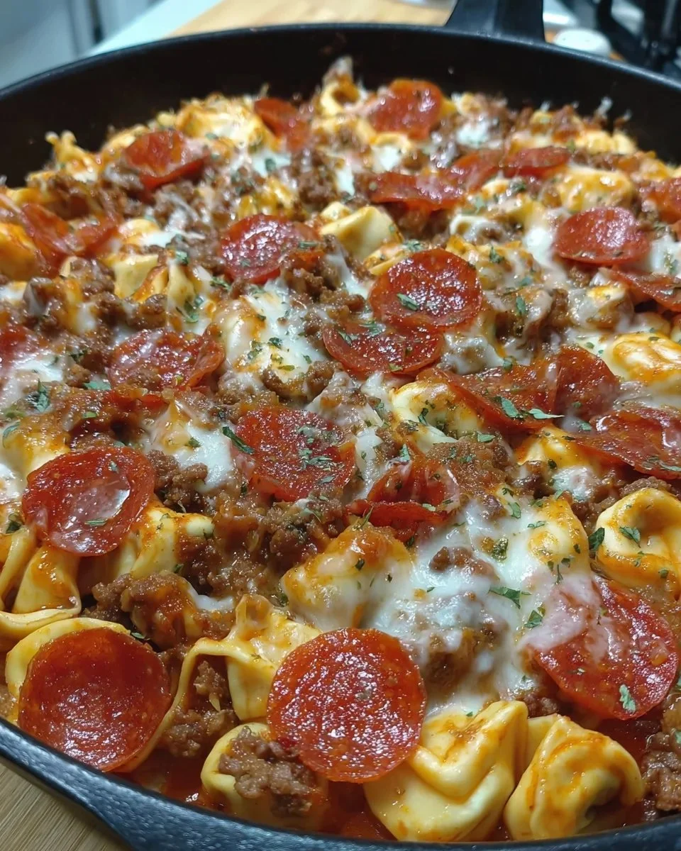 Cheesy Pizza Tortellini Skillet with toppings and fresh herbs