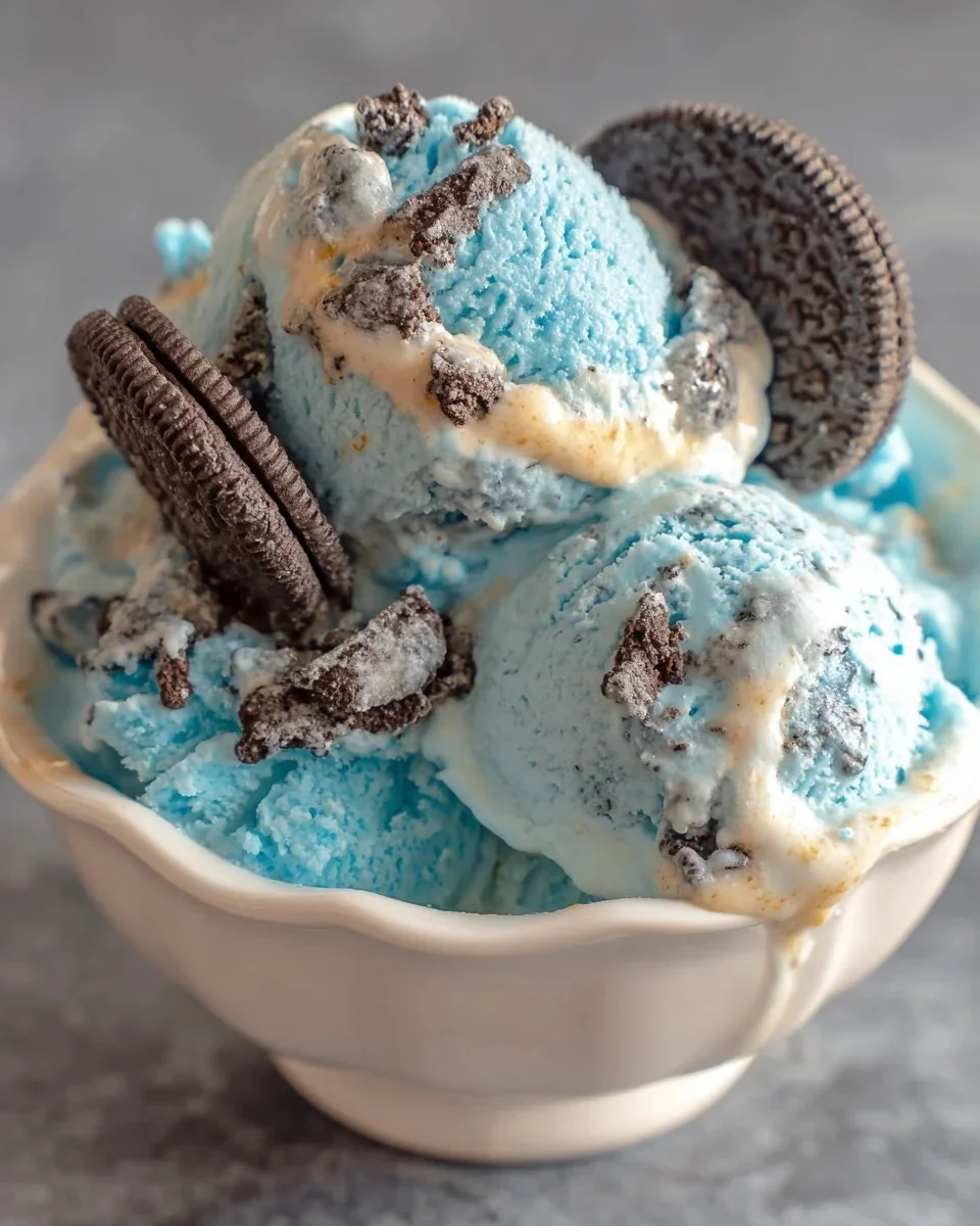 Delicious bowl of Cookie Monster Ice Cream featuring cookie pieces and vibrant blue color