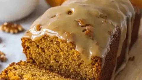 Delicious homemade pumpkin bread drizzled with sweet maple glaze