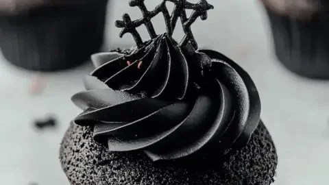 Delicious black velvet cupcakes with spooky decorations for Halloween gatherings