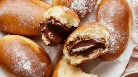 Delicious sugar donuts filled with rich chocolate for a comforting treat