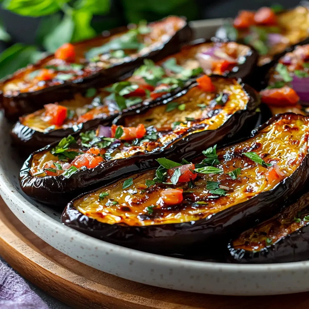 Delicious Mediterranean roasted eggplant garnished with herbs and spices.