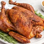Smoky herb-rubbed spatchcocked turkey ready for a festive table