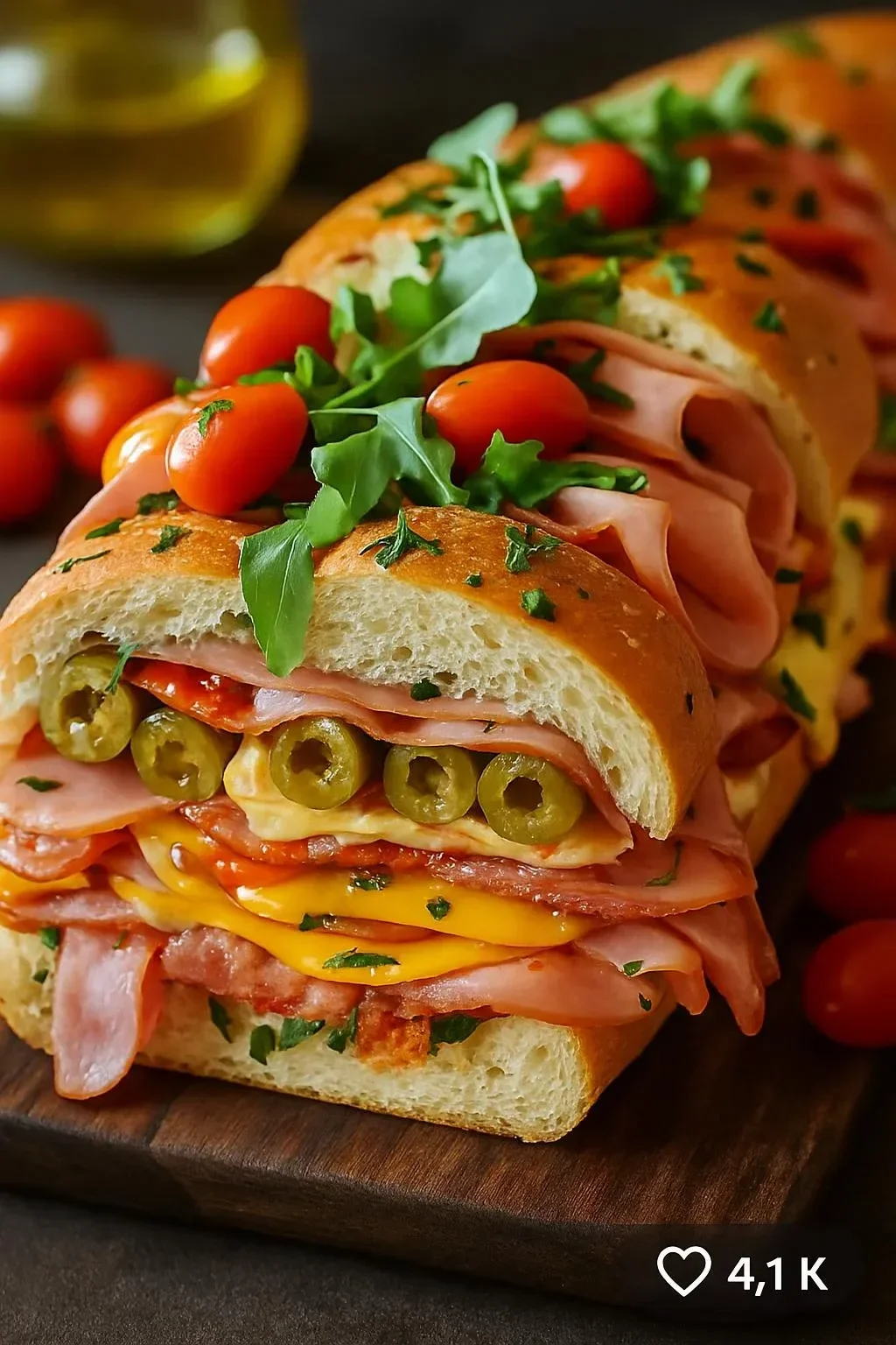 Classic Italian Muffuletta sandwich with meats, cheeses, and olive salad on bread.