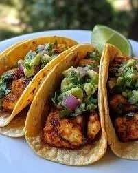Crispy Poblano chicken tacos with avocado-jalapeño salsa on a plate