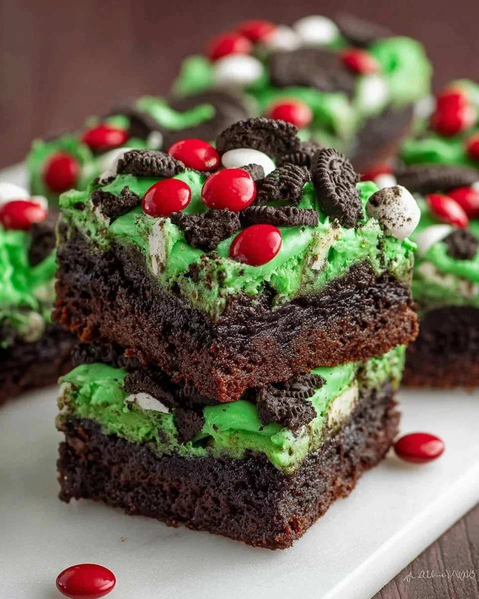 Decadent Grinch Brownies decorated for a festive holiday dessert table.