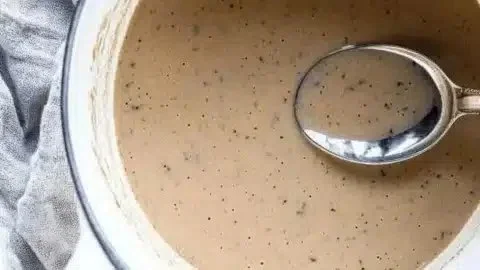 Bowl of homemade make ahead white wine gravy for festive meals
