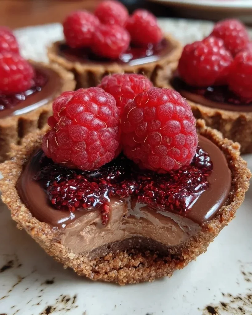 Delicious no-bake raspberry chocolate mousse dessert in a glass