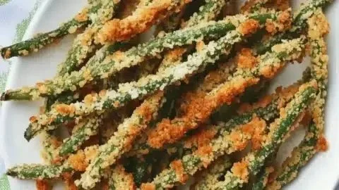 Oven-baked Parmesan green bean fries served with dipping sauce