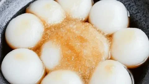 A delicious plate of Shiratama Dumplings served with sweet sauce and toppings