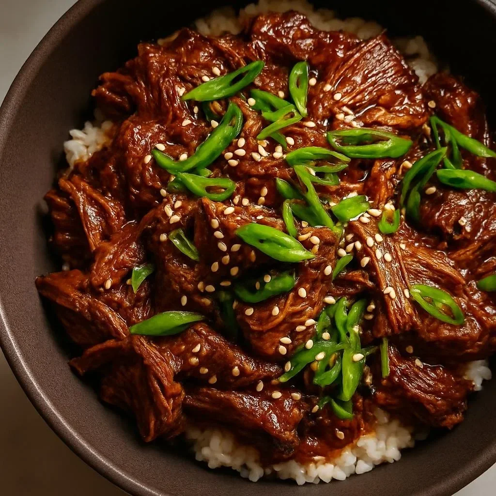 Slow Cooker Korean Beef served in a bowl with rice and vegetables