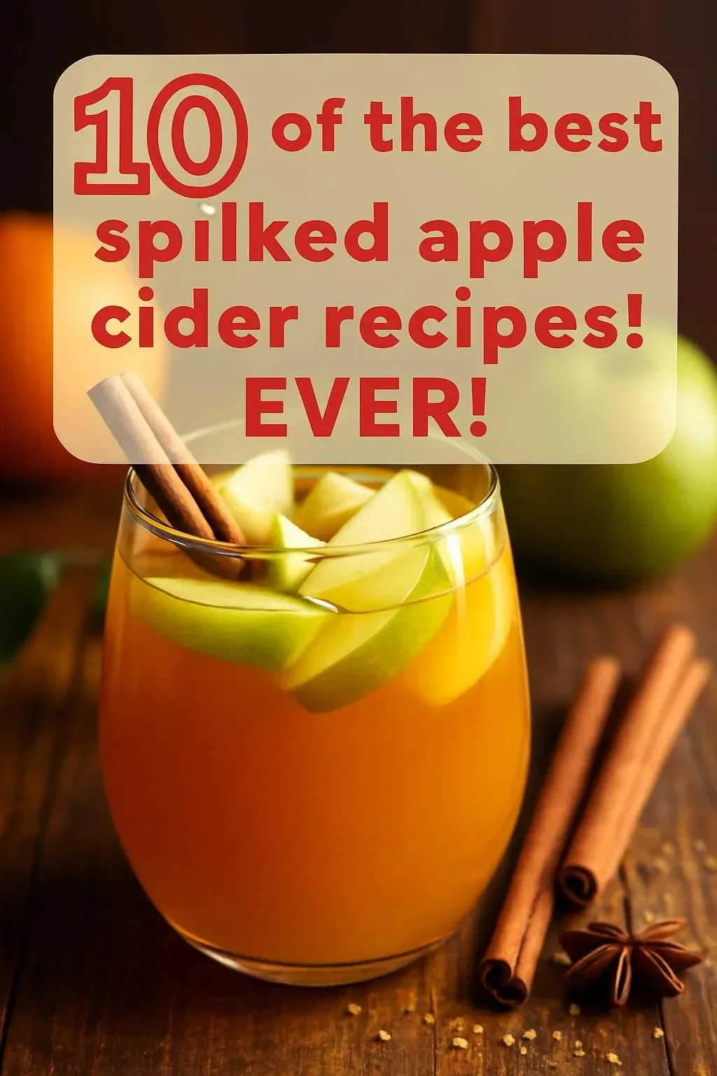Glass of spiked apple cider with cinnamon sticks and apple slices