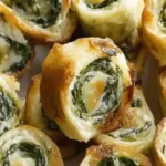 Bite-sized pinwheels filled with creamy spinach dip, perfect for appetizers