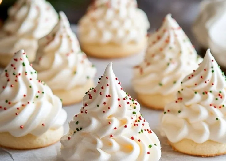 Festive tree-shaped meringue cookies on a plate