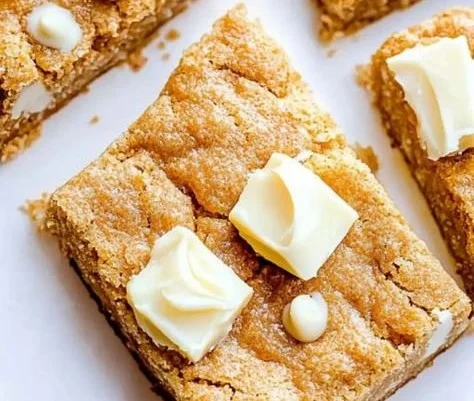 Christmas Biscoff white chocolate chip bars on a festive plate