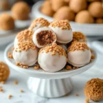 No-bake Biscoff truffles topped with chocolate and crushed Biscoff cookies