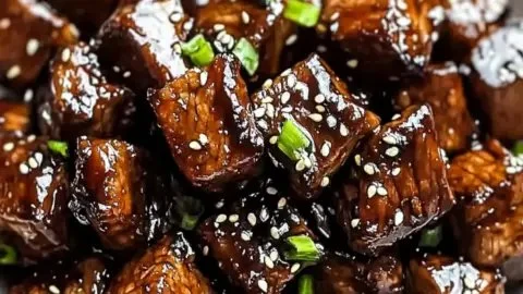 Delicious Asian steak bites served on a platter with garnishes