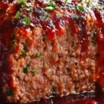 Savory smoked meatloaf topped with a sweet glaze for family dinners